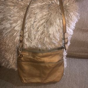 The sak gold leather handbag